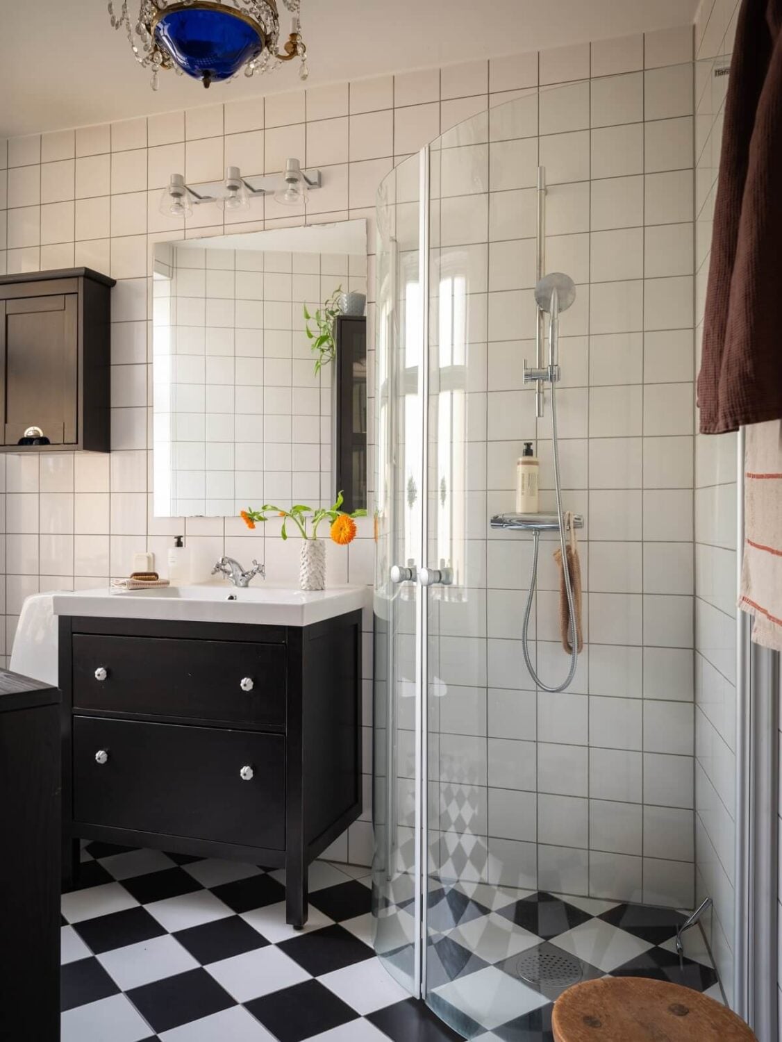 Original Details in a Light-Filled Swedish Apartment 15 bathroom with checkerboard floor