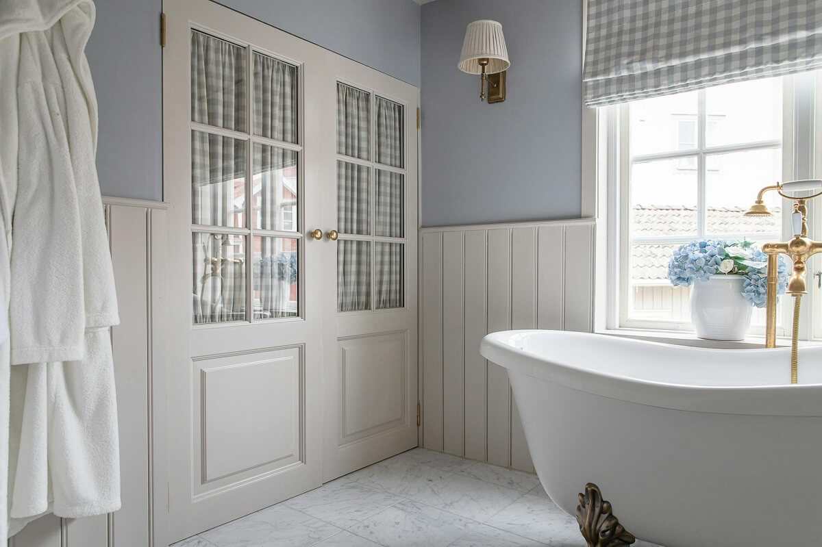 A Classic and Luxurious Lakeside Home in Sweden 21 bathroom with freestanding bath luxurious summer house sweden nordroom