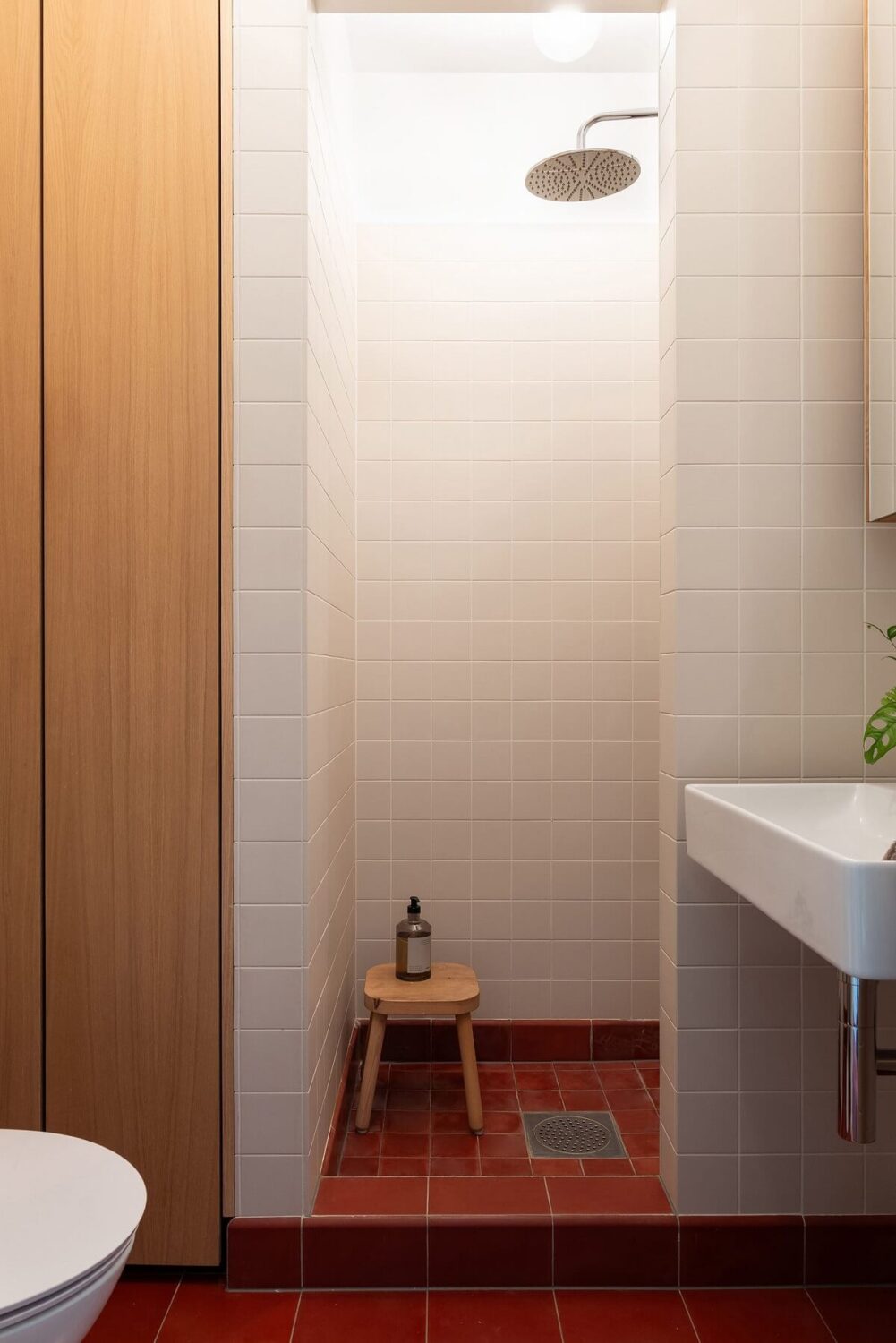Light Rooms in a Renovated Historic Apartment in Stockholm 23 bathroom with red tiled floor nordroom