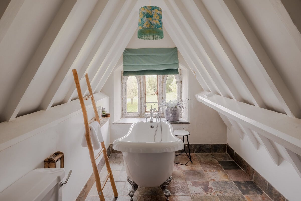 A Charming Gothic-Style Home with Original Details 31 bathroom with white pitched ceiling nordroom