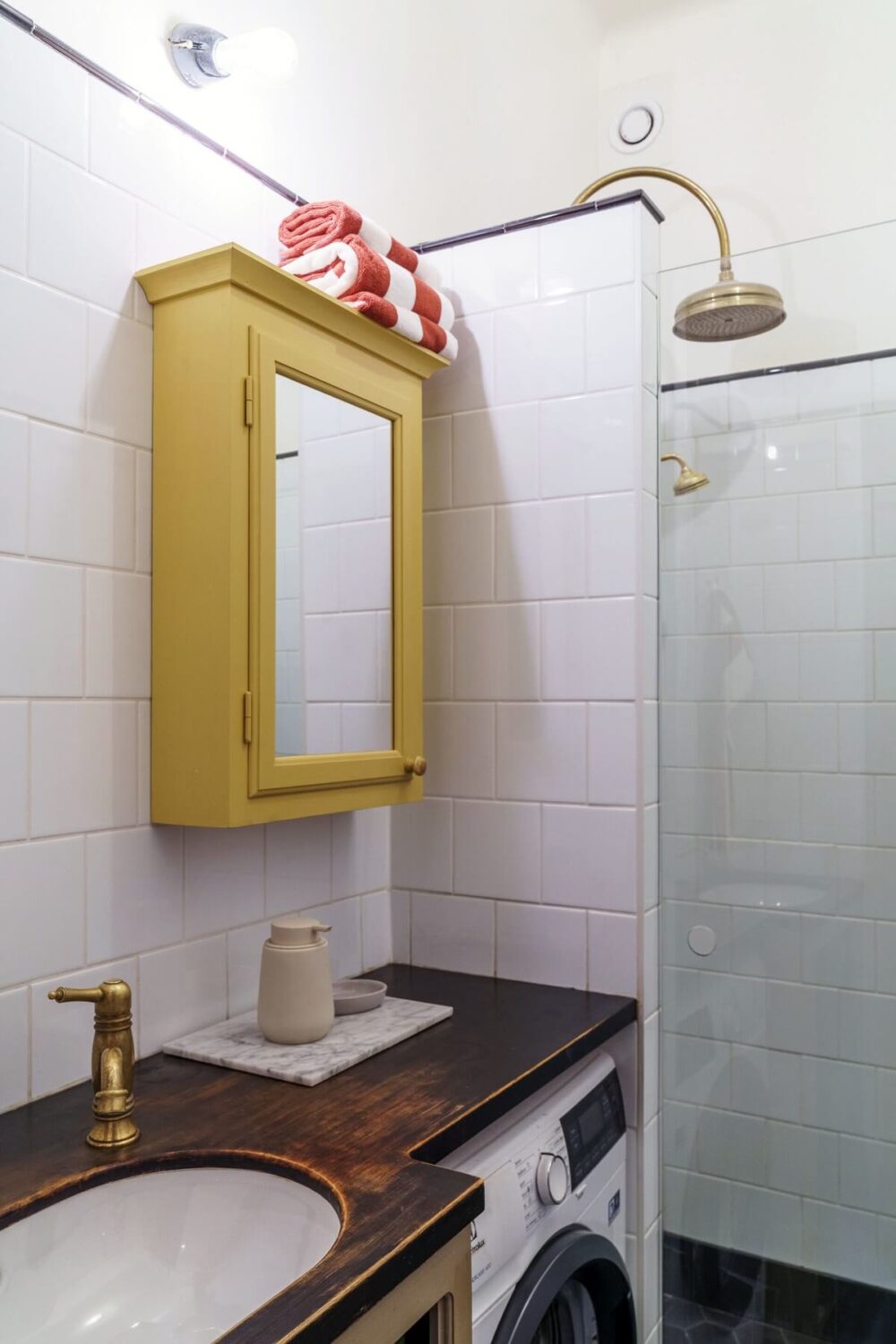 A Unique Courtyard Home in Stockholm 11 bathroom with yellow medicine cabinet A Unique Courtyard Home in Stockholm