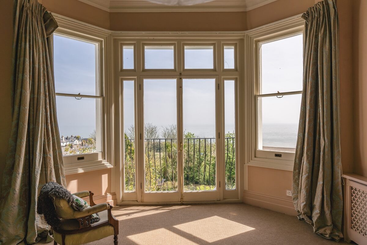 Grand Rooms and Vibrant Colors in an English Country Home 15 bedroom bay window with a view