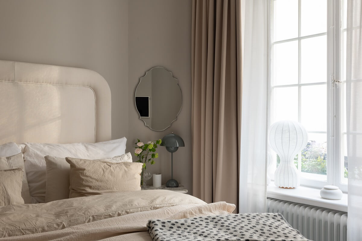 A Classic Look for a Swedish Apartment 14 bedroom detail with round mirror