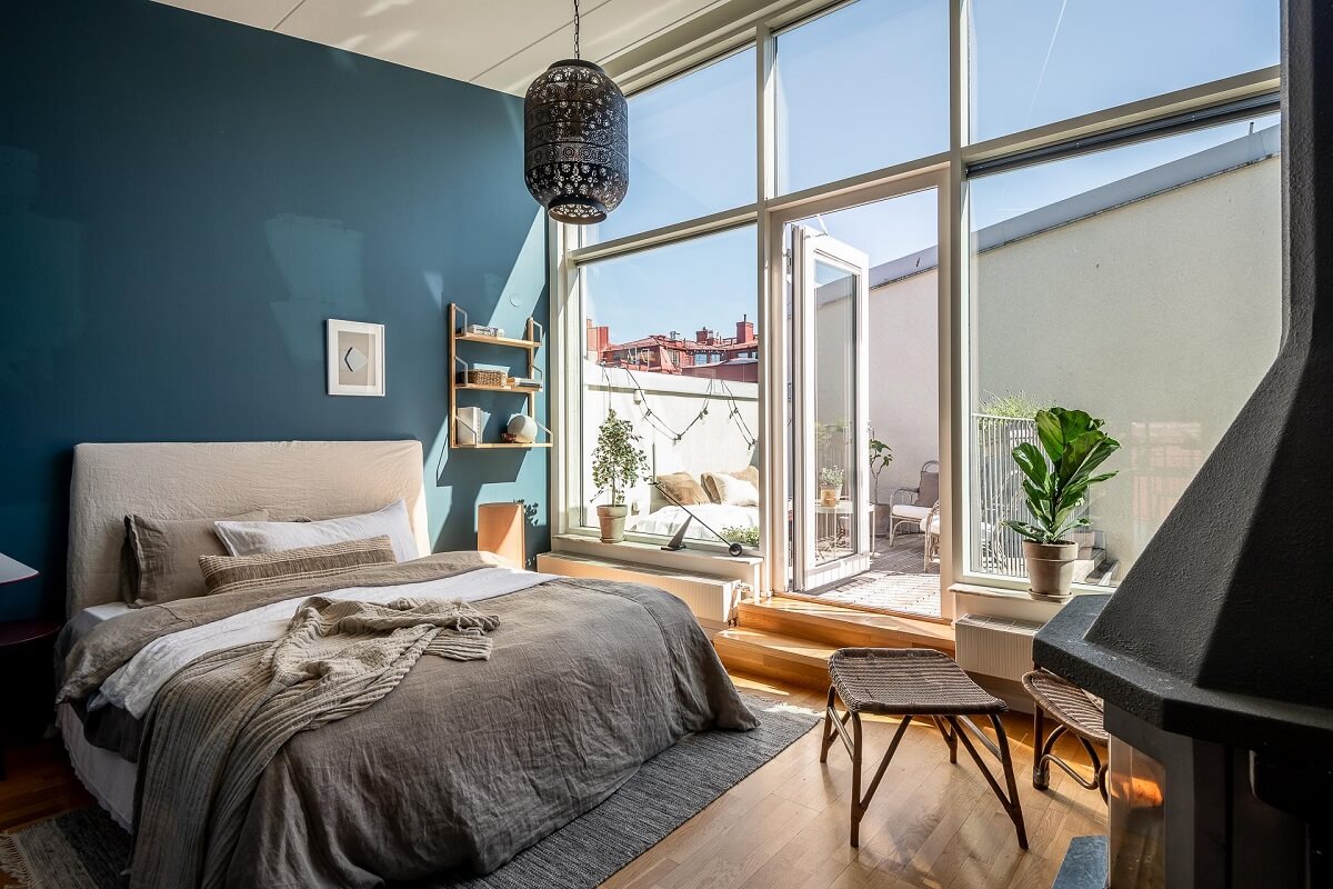 Floor-to-Ceiling Bookcases and Windows in a Loft Style Apartment 17 bedroom large windows blue walls and roof terrace nordroom