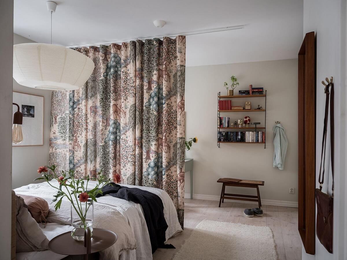 A Light Two Bedroom Apartment in Gothenburg 11 bedroom with floral curtain room divider nordroom