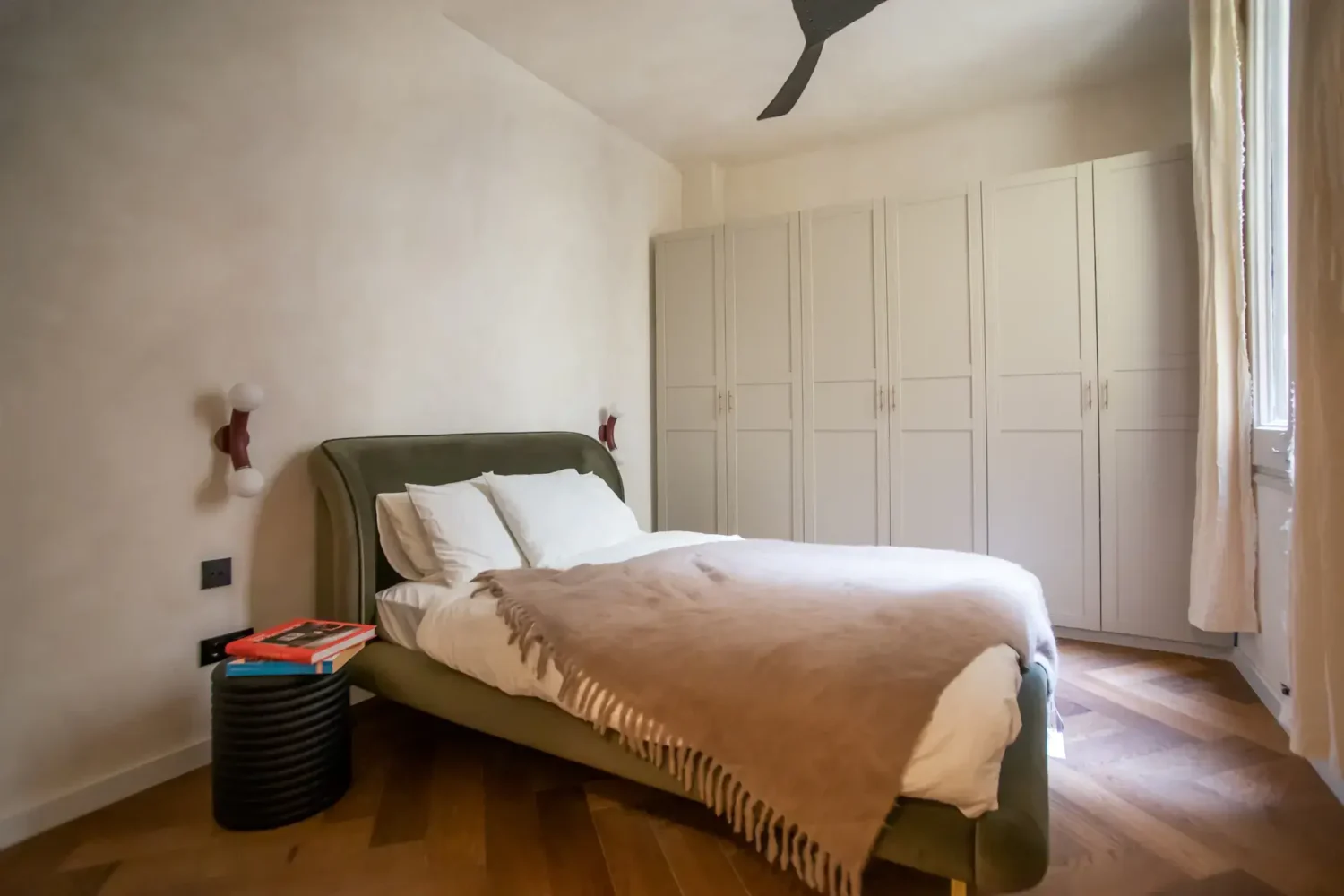 A Serene Apartment in Barcelona's Gothic Quarter 8 bedroom with green headboard