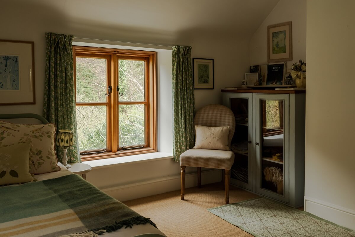 Ochre Yellow and Green Tones in a Cozy Welsh Cottage 22 bedroom with low ceiling