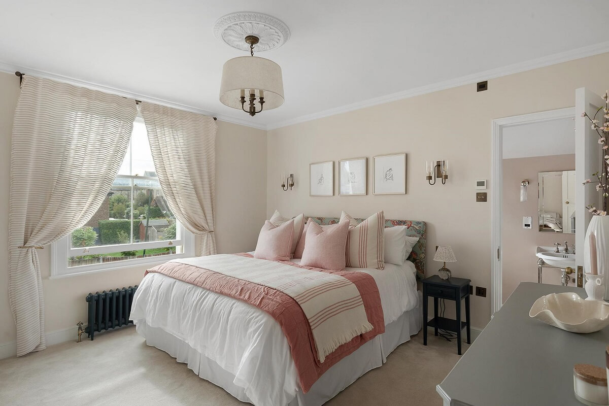 A Victorian House with a Blue deVOL Kitchen 12 bedroom with pink color accents