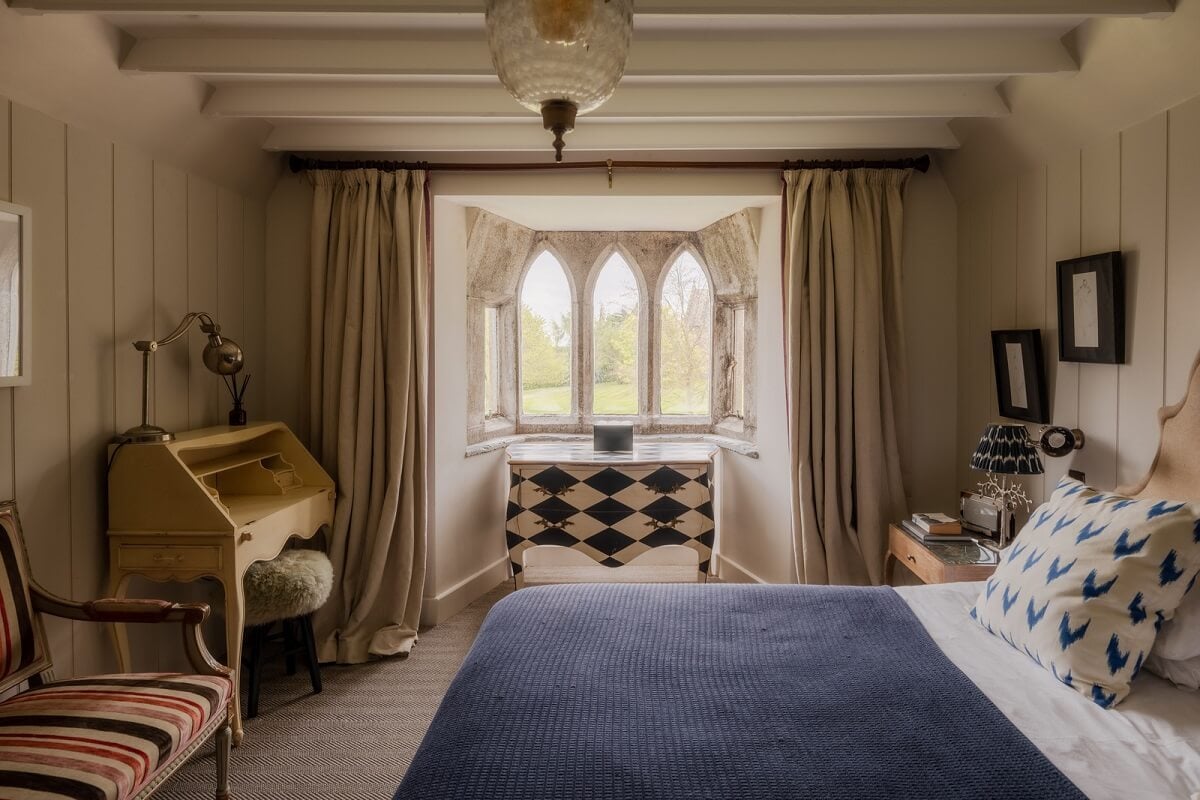 A Charming Gothic-Style Home with Original Details 22 bedroom with wooden beams nordroom