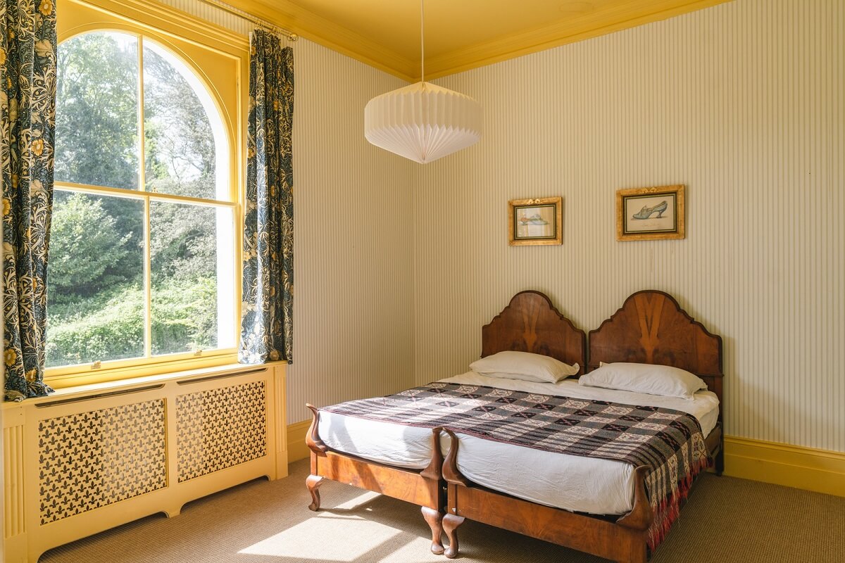 Grand Rooms and Vibrant Colors in an English Country Home 16 bedroom with yellow ceiling