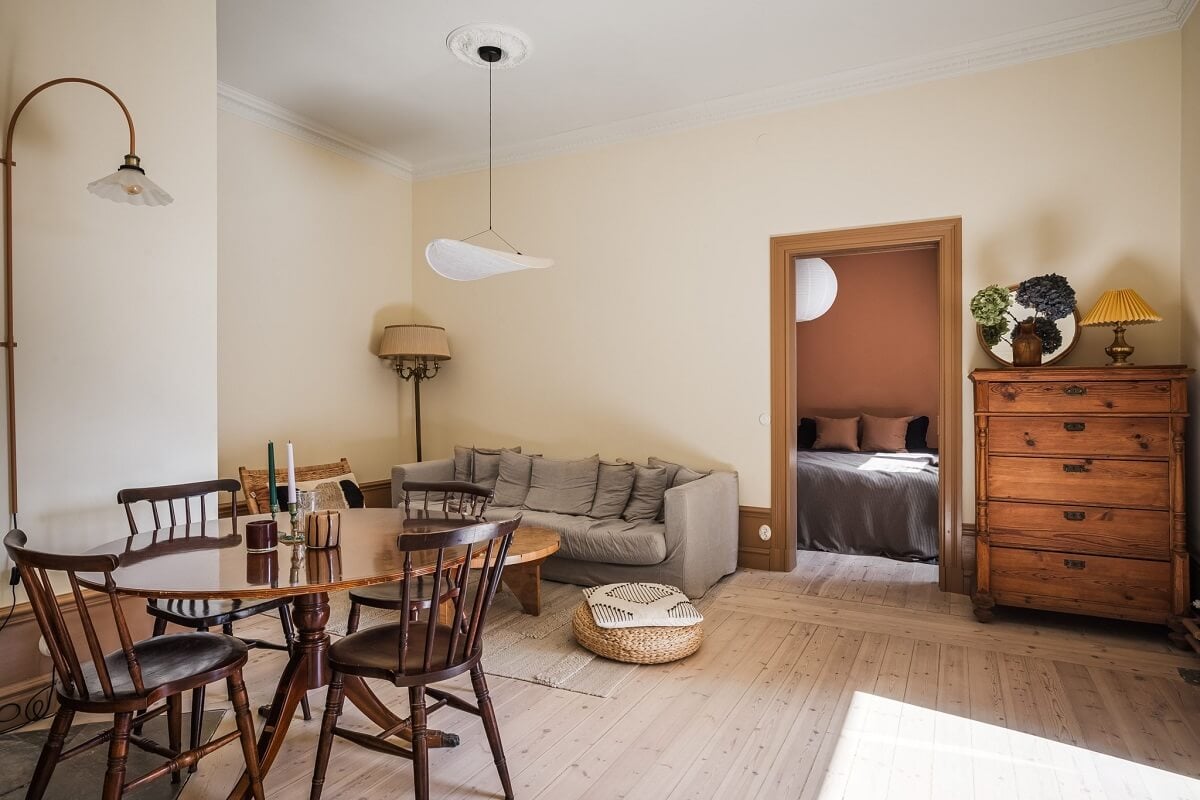 Warm Color Tones in a Scandinavian Apartment 3 beige living room with round table