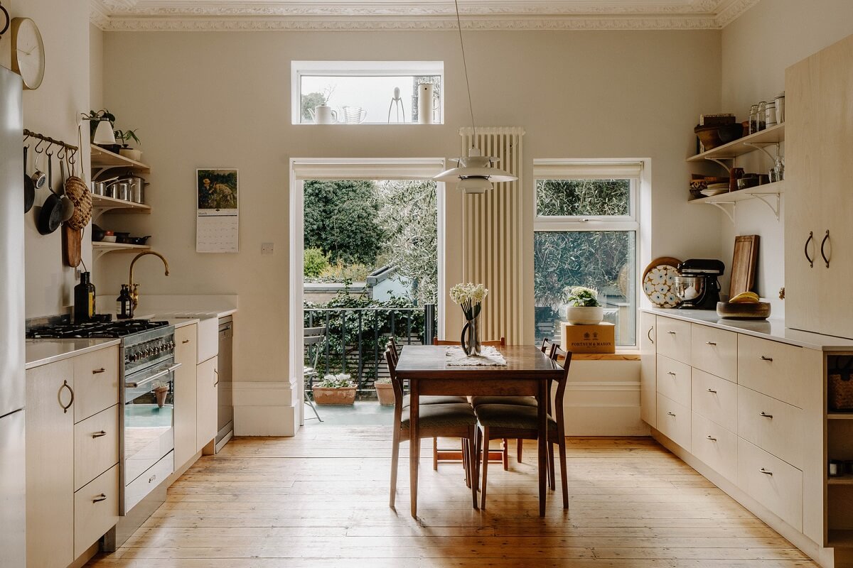 Neutral Tones and Original Features in an English Townhouse 1 birch ply kitchen with dining table