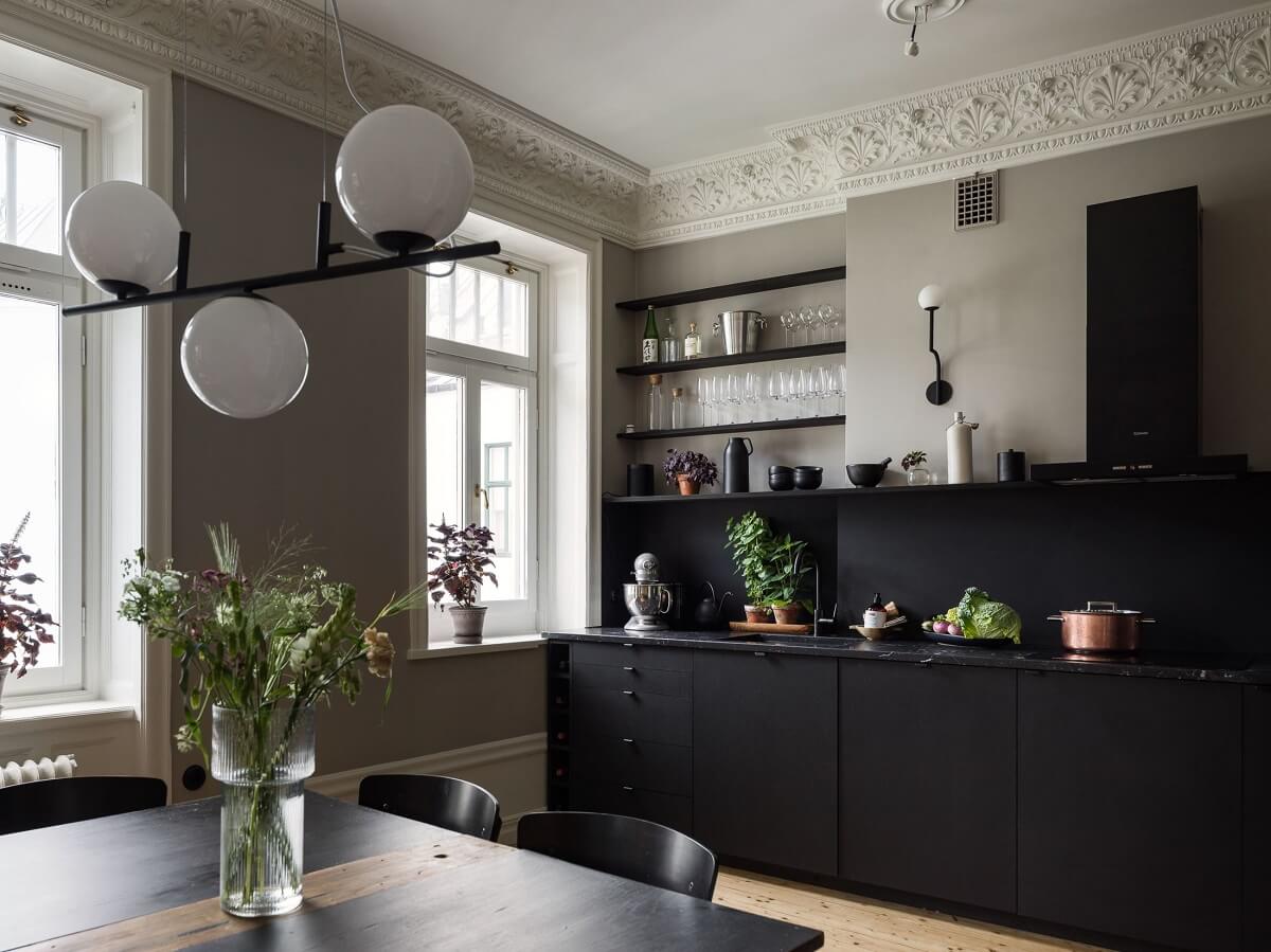 A Gray Stockholm Apartment with a Black Kitchen 8 black kitchen cabinets and gray walls nordroom
