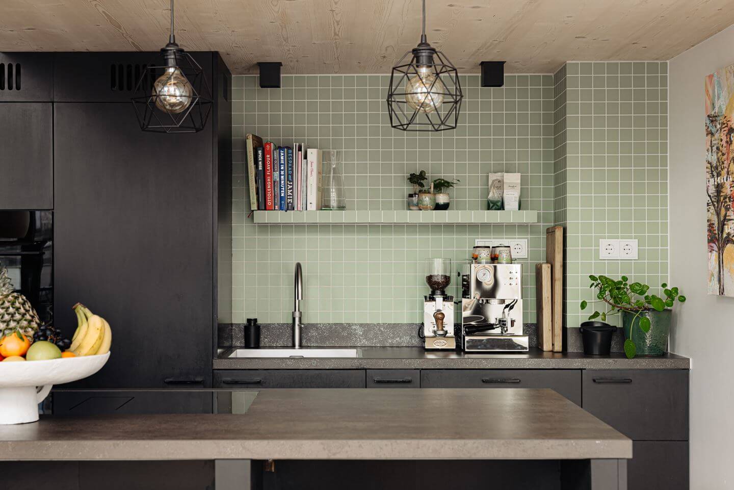 A Modern Loft-Style School Conversion in Amsterdam 2 black kitchen with concrete worktop and green tiles nordroom