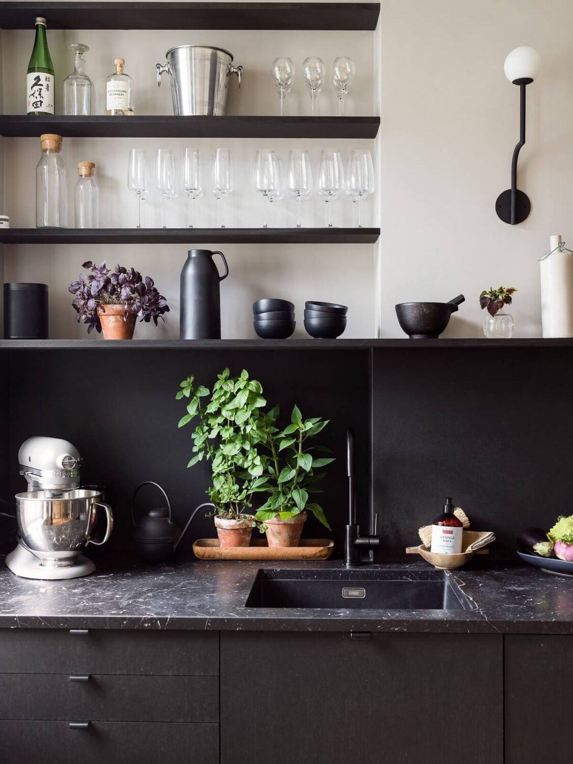 A Gray Stockholm Apartment with a Black Kitchen 6 black kitchen with shelves and gray farrow and ball walls nordroom