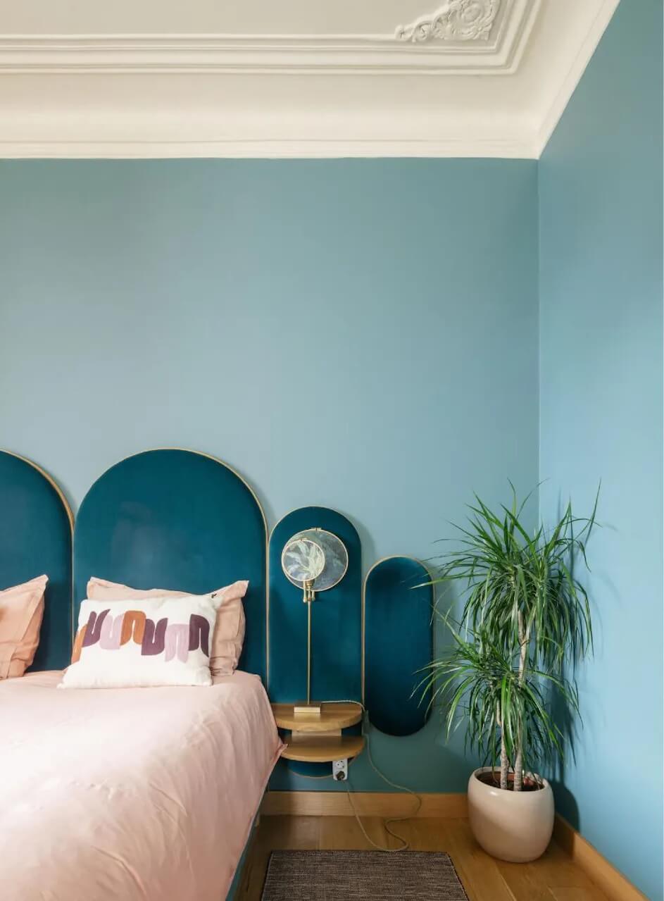 Color Touches in a Design Apartment in a Historic Villa 8 blue bedroom with velvet headboard nordroom