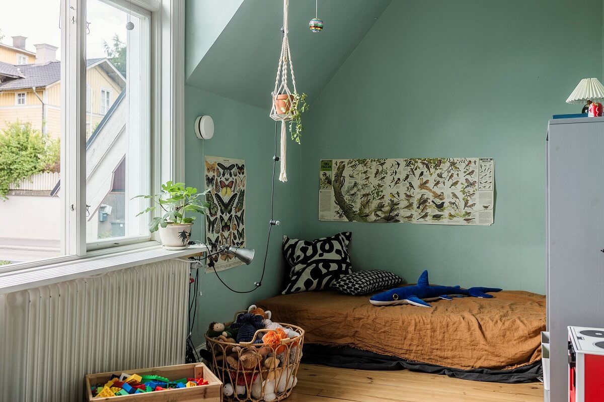 A Historic Swedish Country House with a Beautiful Garden 22 blue children bedroom with slanted ceiling