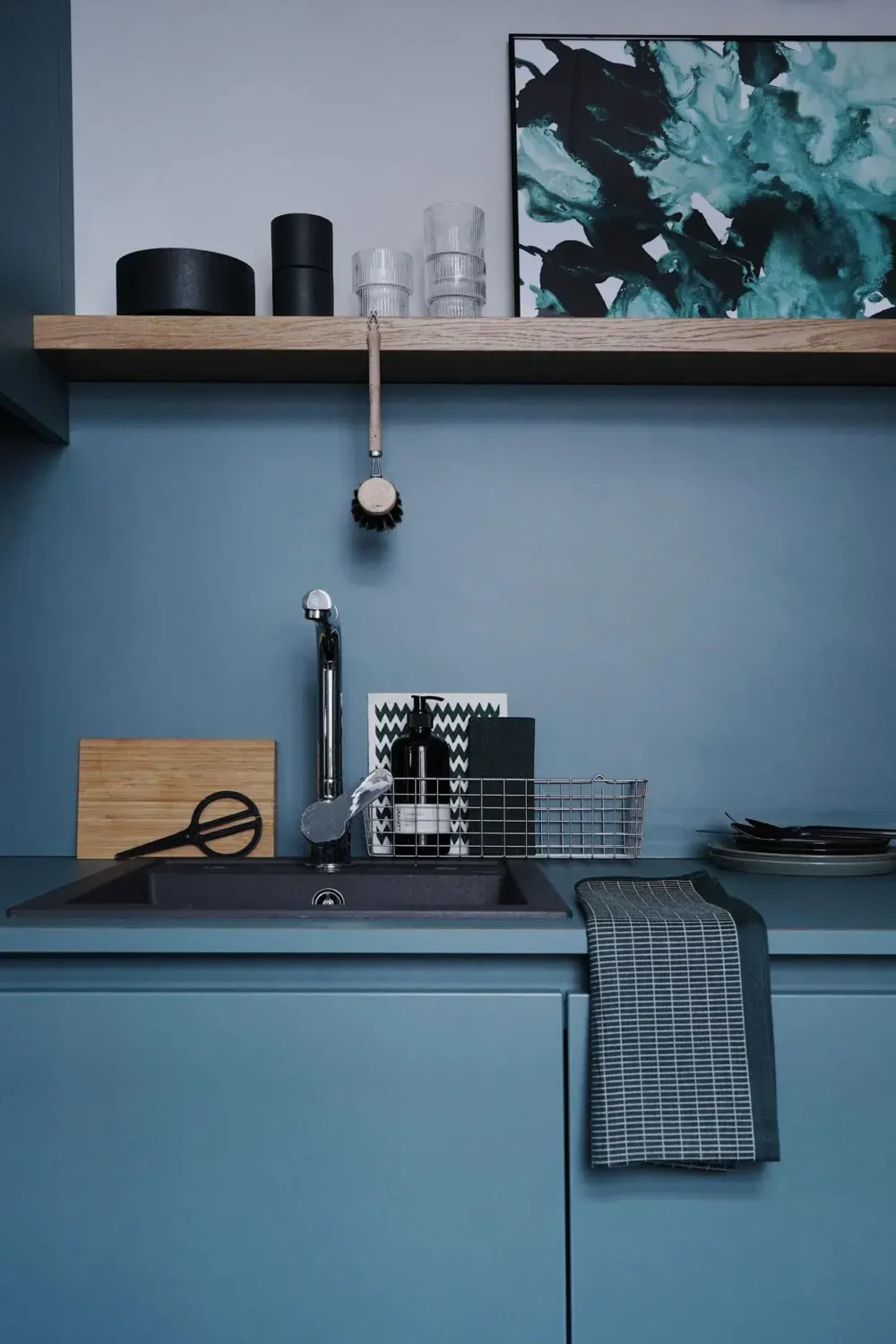 A Blue Kitchen in a Modern Design Apartment in Berlin 3 blue kitchen with wooden shelf