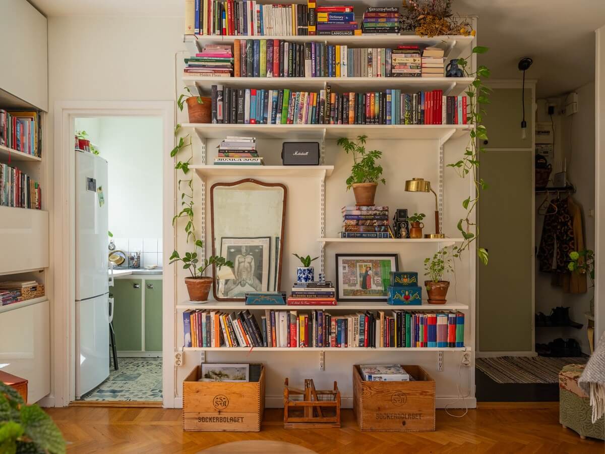 A Studio Apartment with Vintage Green Cabinets 6 bookshelves in studio