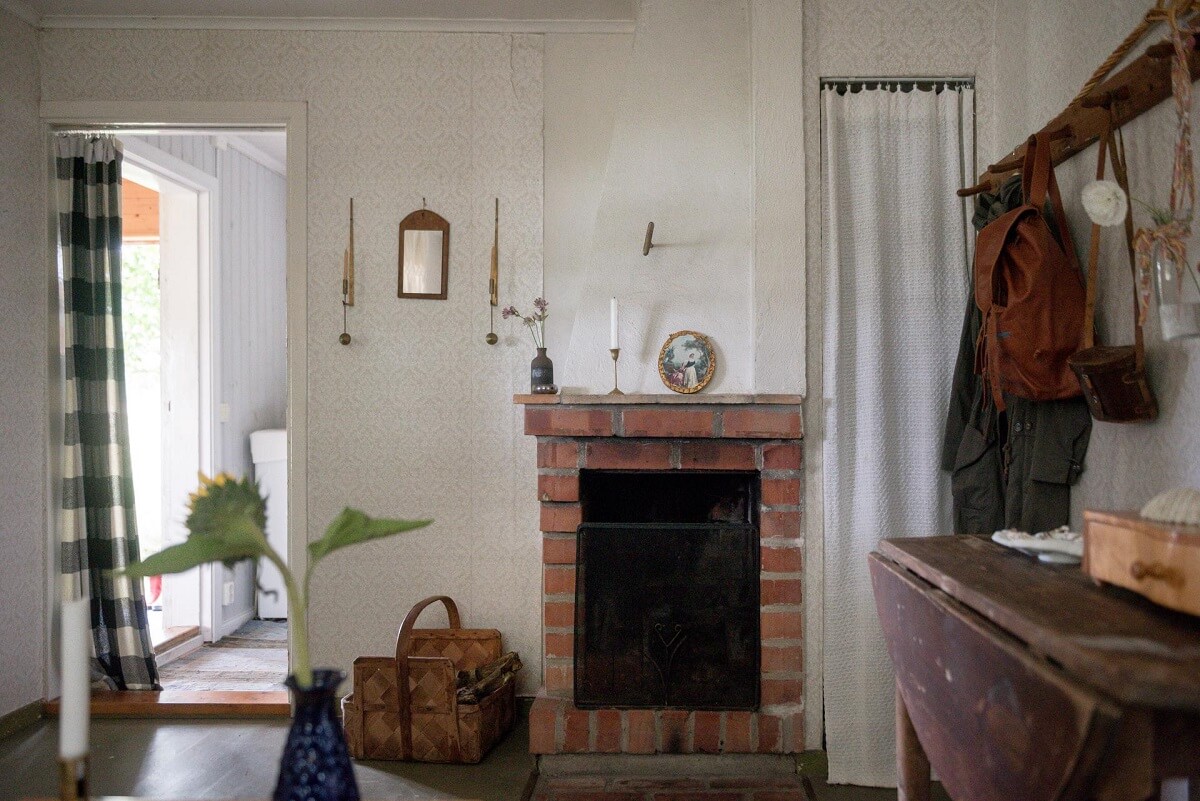 A Traditional Summer House Cabin in Sweden 13 brick fireplace traditional wooden summer cottage sweden nordroom