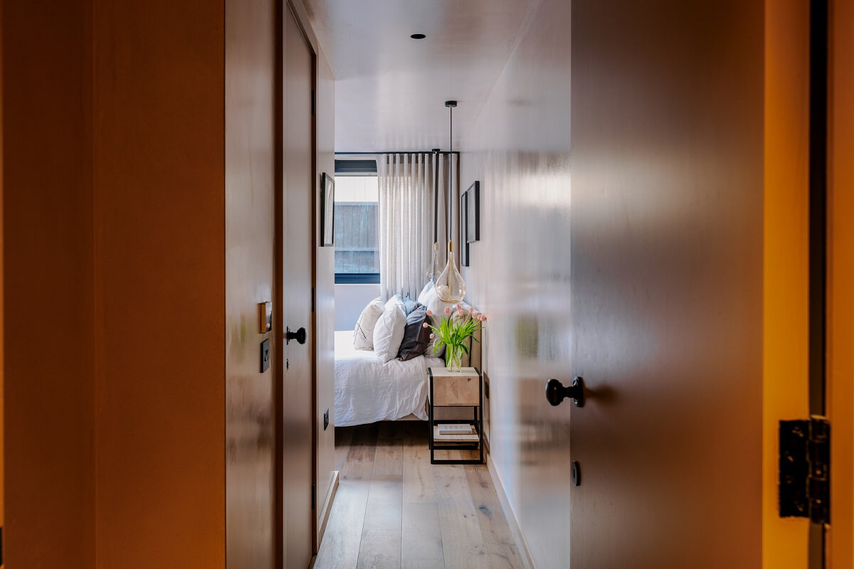 Warm Color Tones in a London Apartment with a Garden 8 brown walls bedroom view