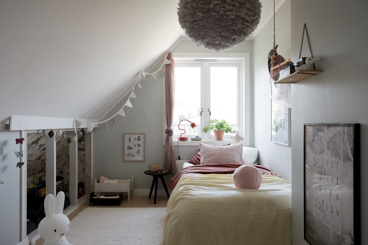 A Pink Swedish House with a Lovely Garden 18 children bedroom with slanted ceiling