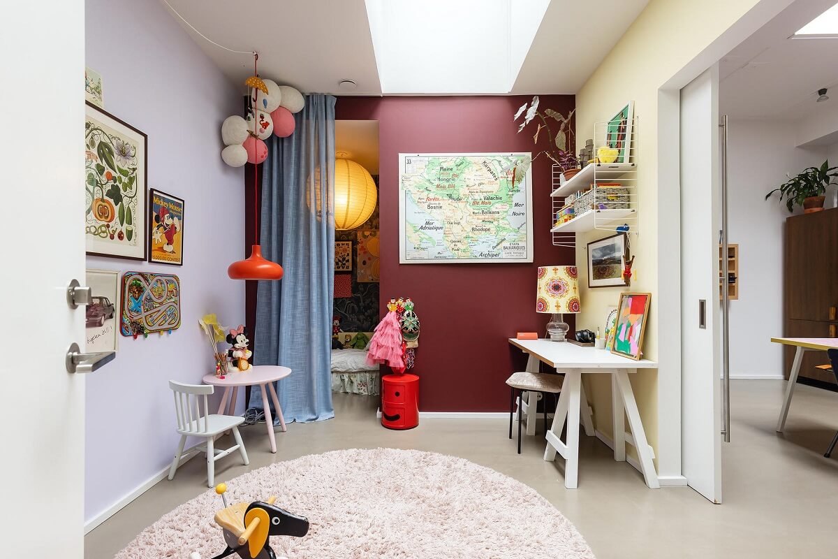 A Unique Basement Apartment in Stockholm 19 children room with deep red wall and skylight nordroom