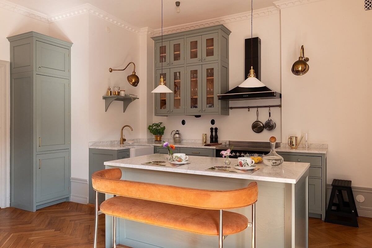 An Elegant Turn-of-the-Century Apartment in Stockholm 4 classic gray kitchen with island and seating bench nordroom