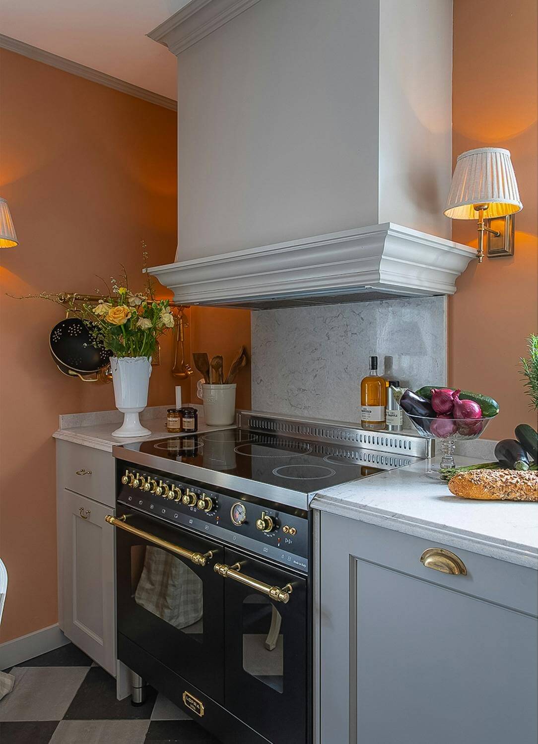 A Classic and Luxurious Lakeside Home in Sweden 14 classic gray kitchen with orange wall luxurious summer house sweden nordroom A Classic and Luxurious Lakeside Home in Sweden