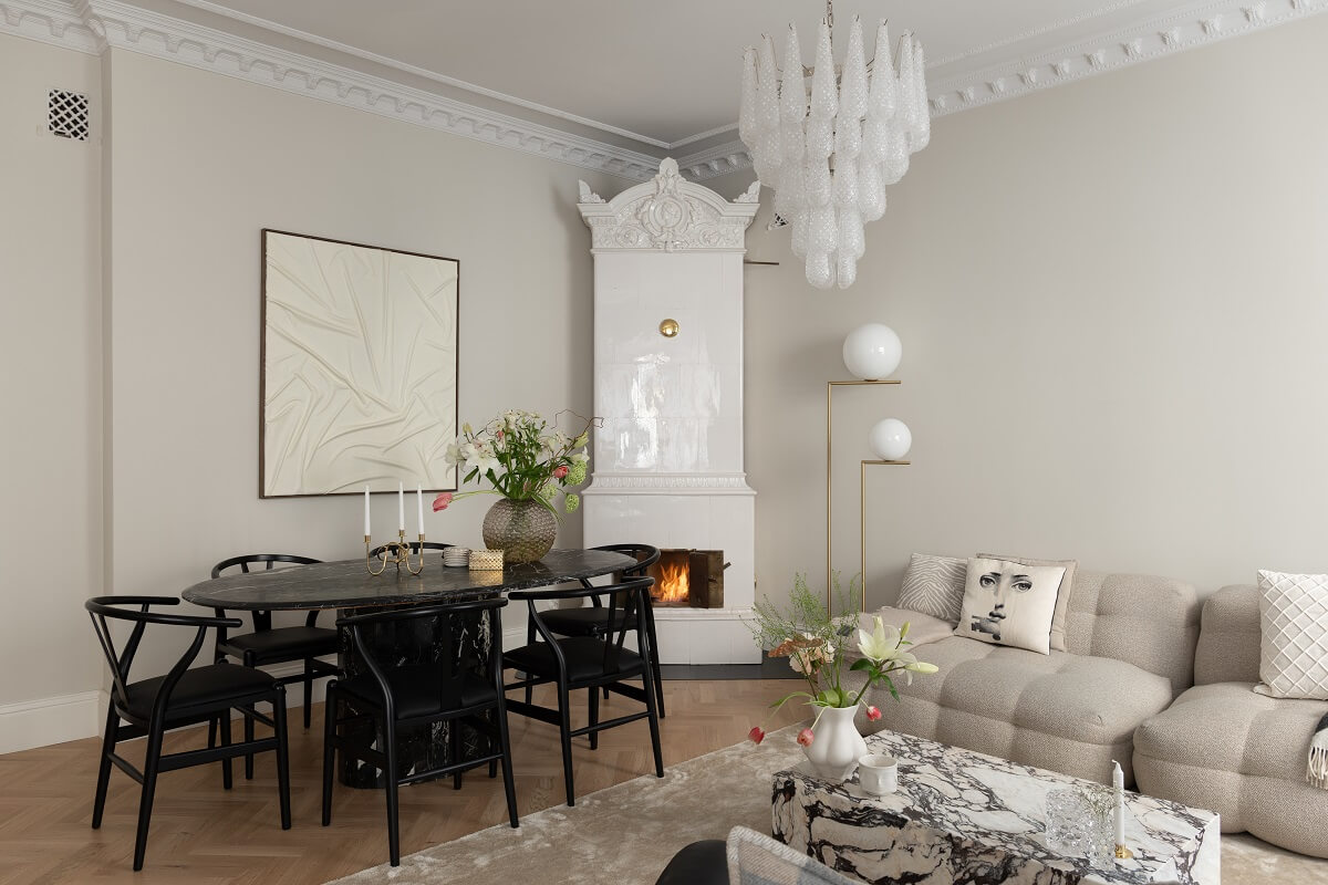 A Classic Look for a Swedish Apartment 1 classic living room with tiles fireplace and dining table nordroom