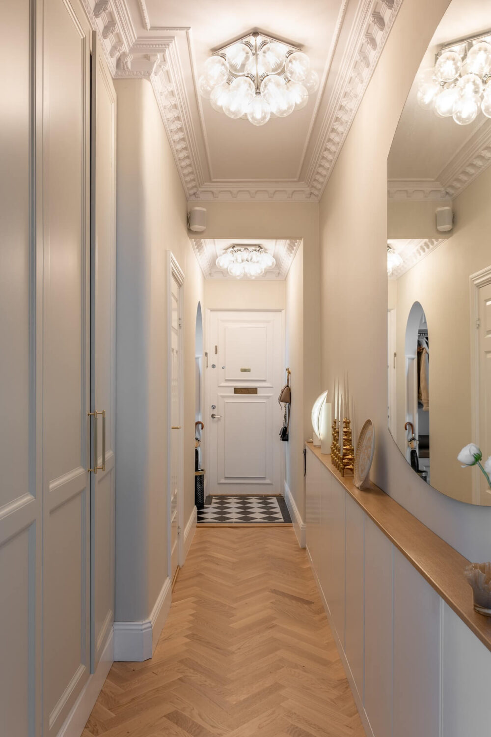 A Classic Look for a Swedish Apartment 16 classic narrow hallway with large mirror and herringbone floor nordroom