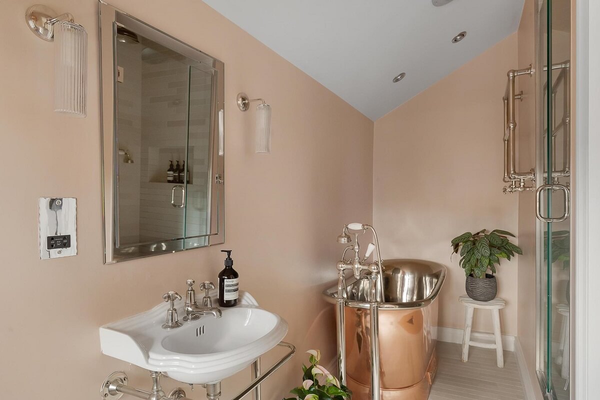 A Victorian House with a Blue deVOL Kitchen 16 copper bath in pink bathroom