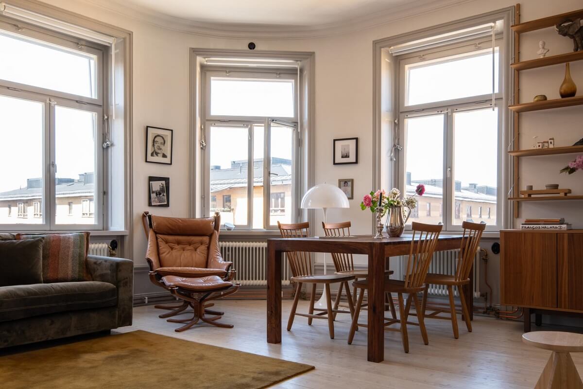 A Corner Apartment with an Industrial Style Kitchen 11 corner living room with dining table