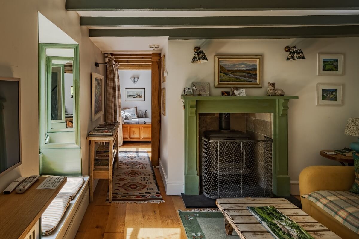 Ochre Yellow and Green Tones in a Cozy Welsh Cottage 6 cottage living room with green fireplace