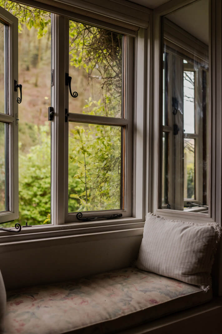 Ochre Yellow and Green Tones in a Cozy Welsh Cottage 12 cottage window seat