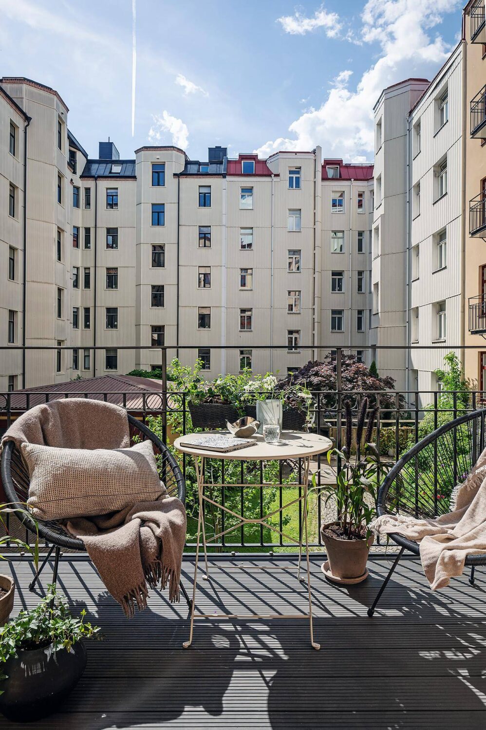 A Luxurious Renovated Apartment with Dark Gray Walls 22 courtyard balcony