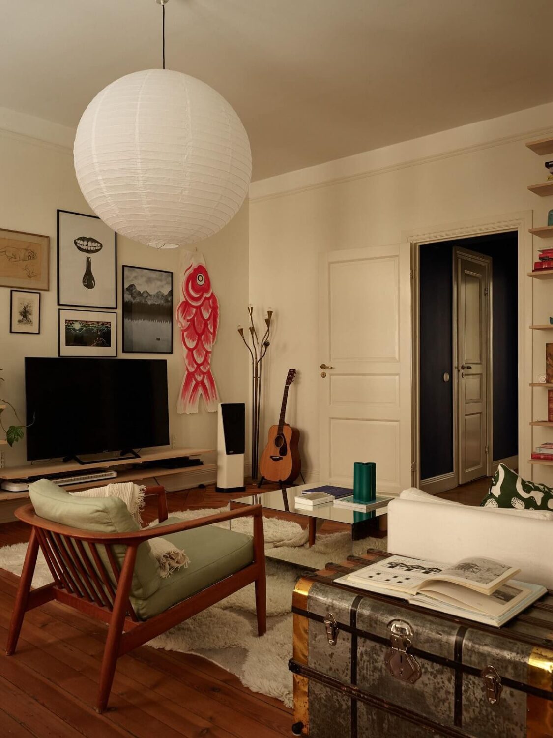 Warm Tones and a Blue Hallway in a Stockholm Apartment 2 cozy living room with wooden floor