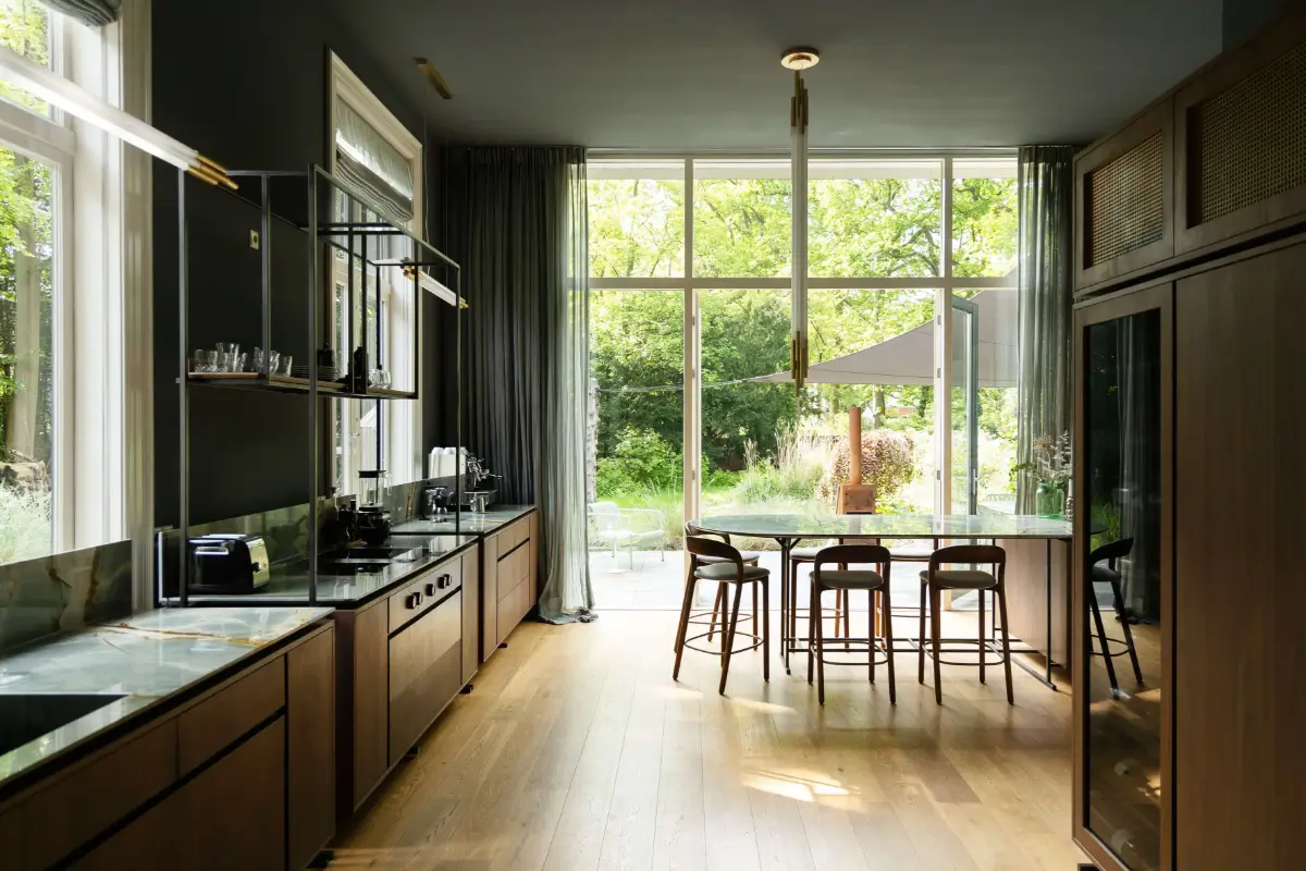 A Warm Atmosphere in a Historic Dutch Villa 11 custom-kitchen-dining-table-garden-doors