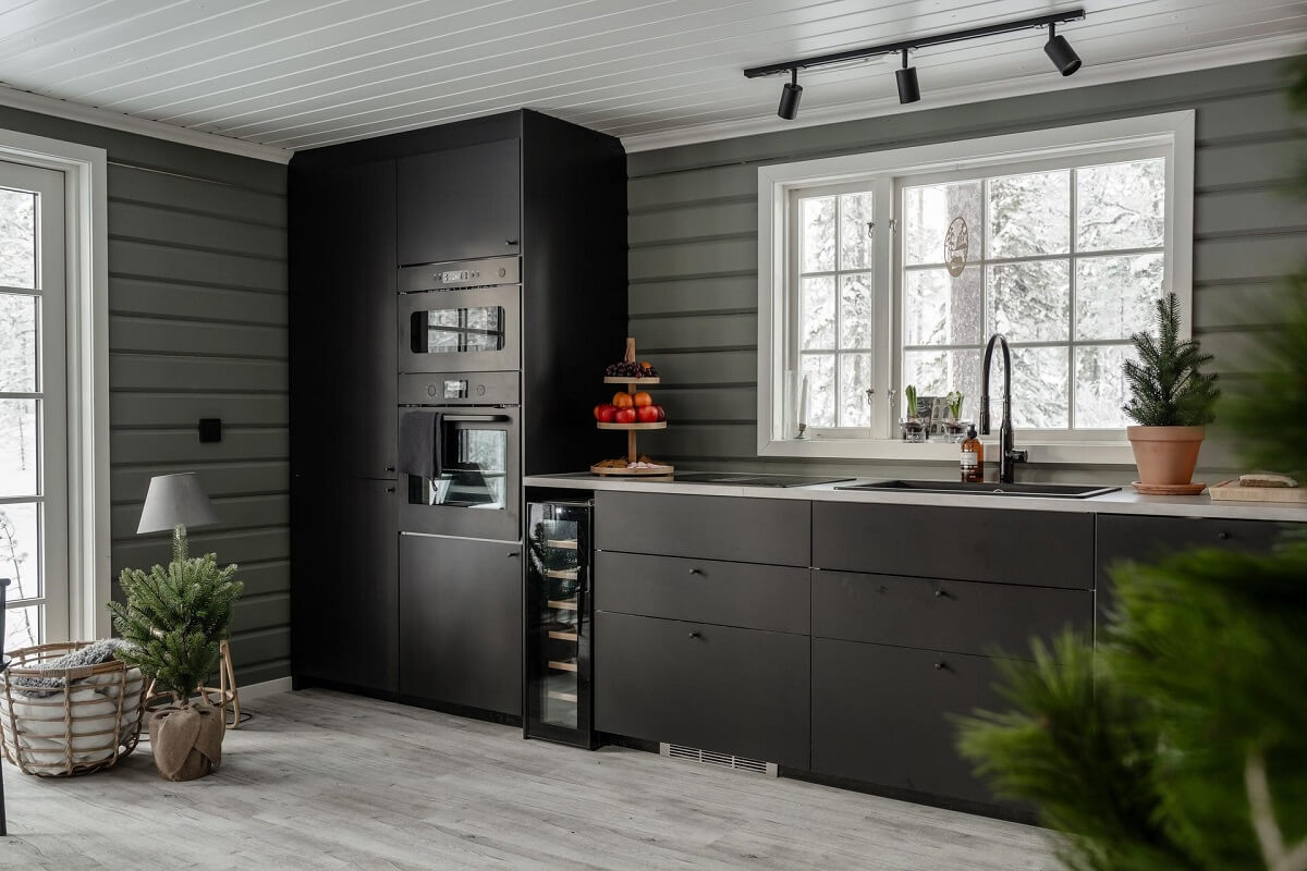 A Gray Swedish Log House Decorated for Christmas 11 dark kitchen in gray log house