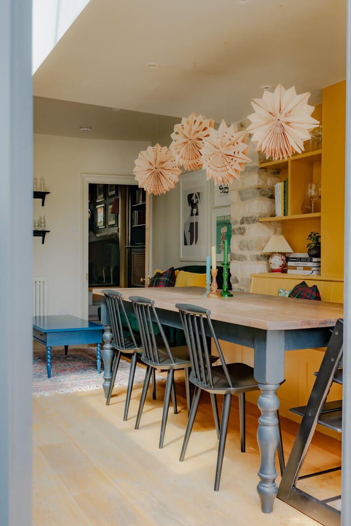 A Rich Color Palette in a Historic English Home 3 dining area with india yellow bench and storage nordroom