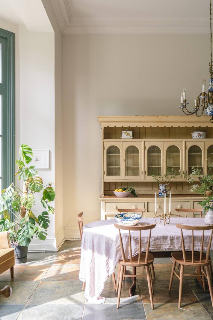Grand Rooms and Vibrant Colors in an English Country Home 10 dining room with yellow cabinet