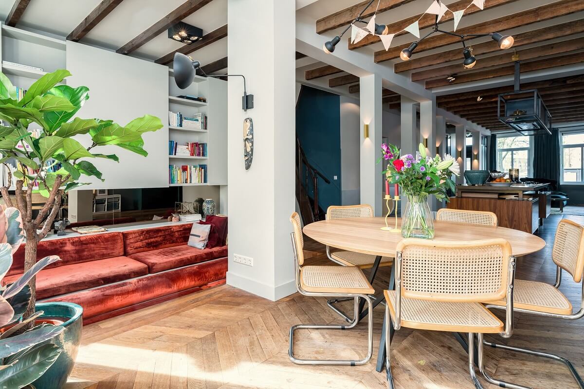 A Colorful Family Home with Open-Plan Spaces in Amsterdam 2 dining table and sunken sitting space in open plan ground floor family home nordroom