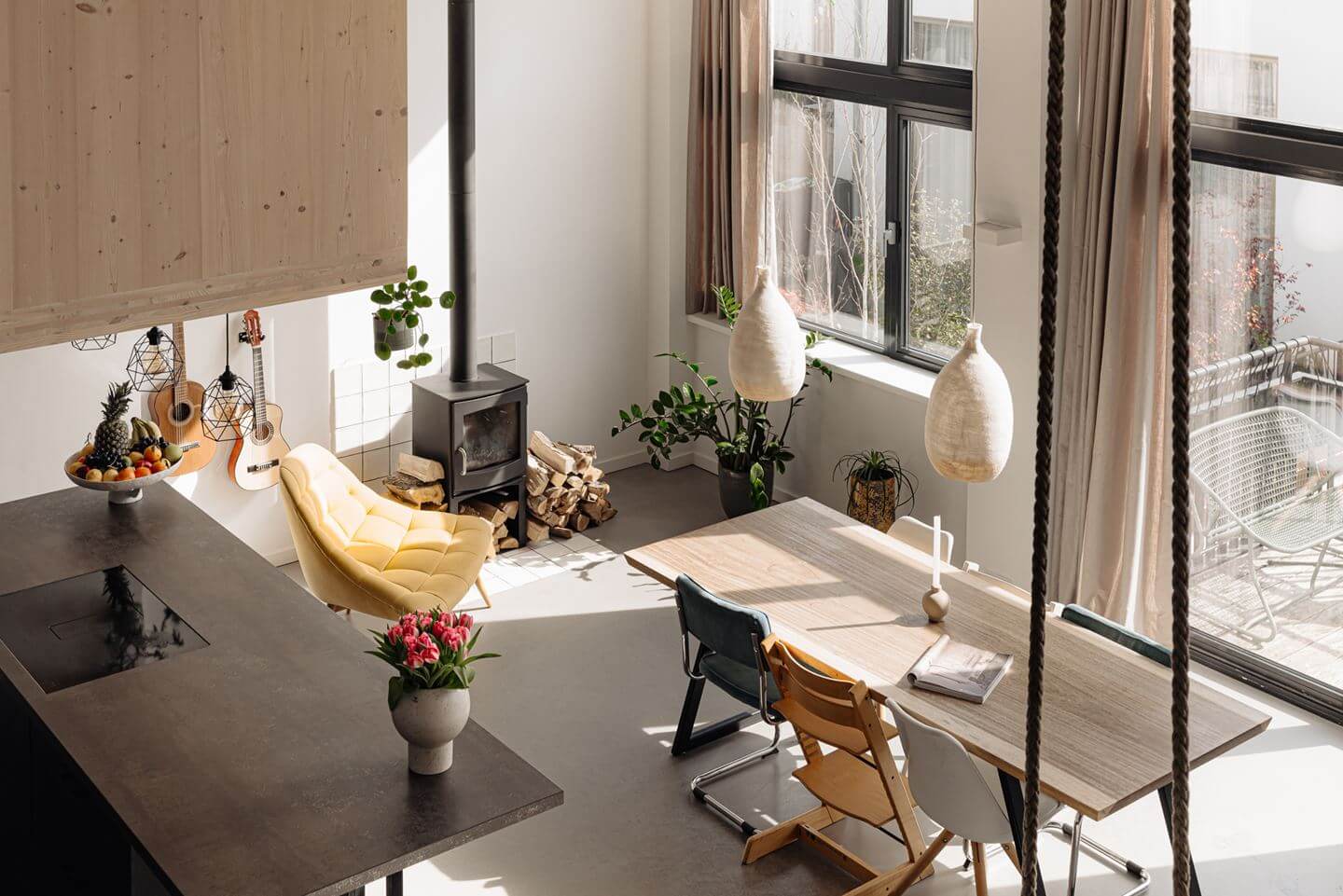 A Modern Loft-Style School Conversion in Amsterdam 4 dining table natural light
