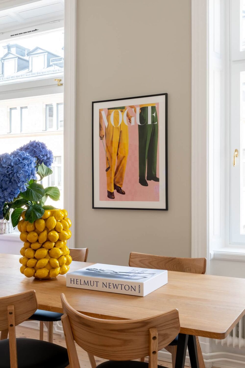 A Light Renovated Apartment in Stockholm 4 dining table with lemon vase