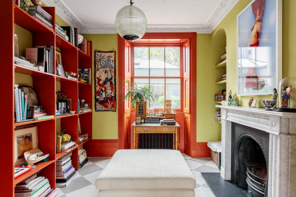 Unique Color Combinations and Design in a London Townhouse 5 double living room with red joinery and fireplace