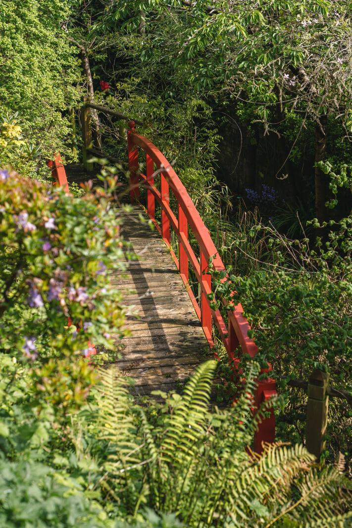Grand Rooms and Vibrant Colors in an English Country Home 19 garden bridge