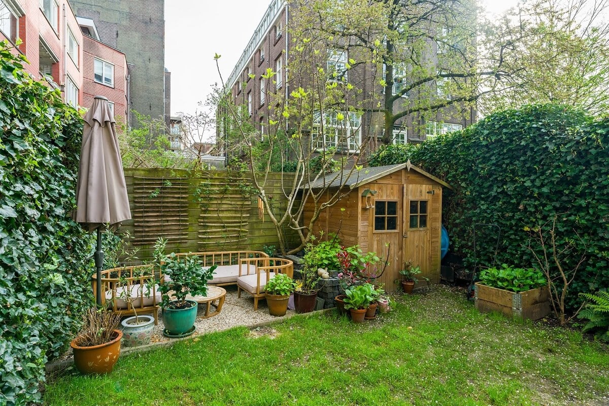 A Colorful Family Home with Open-Plan Spaces in Amsterdam 23 garden with lawn and terrace
