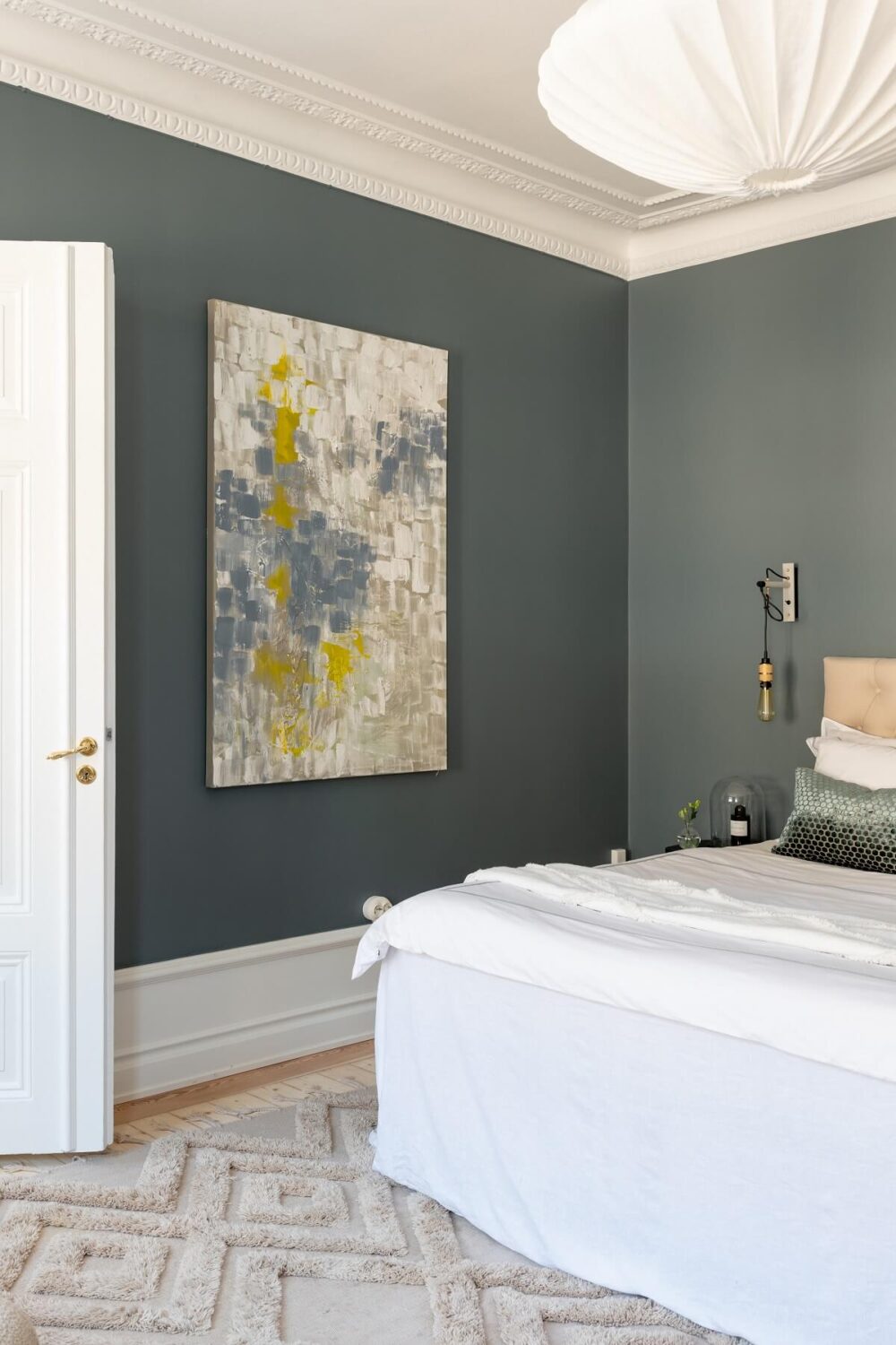 A Light Renovated Apartment in Stockholm 11 gray bedroom with art