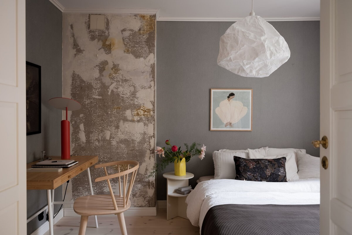 A Pink Swedish House with a Lovely Garden 13 gray bedroom with desk and feature wall