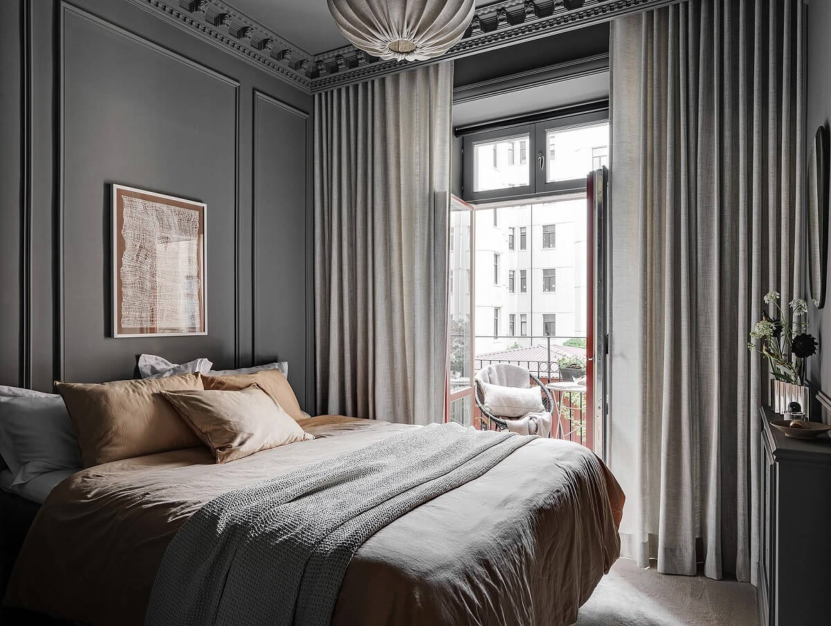 A Luxurious Renovated Apartment with Dark Gray Walls 20 gray bedroom with earth colored bedding